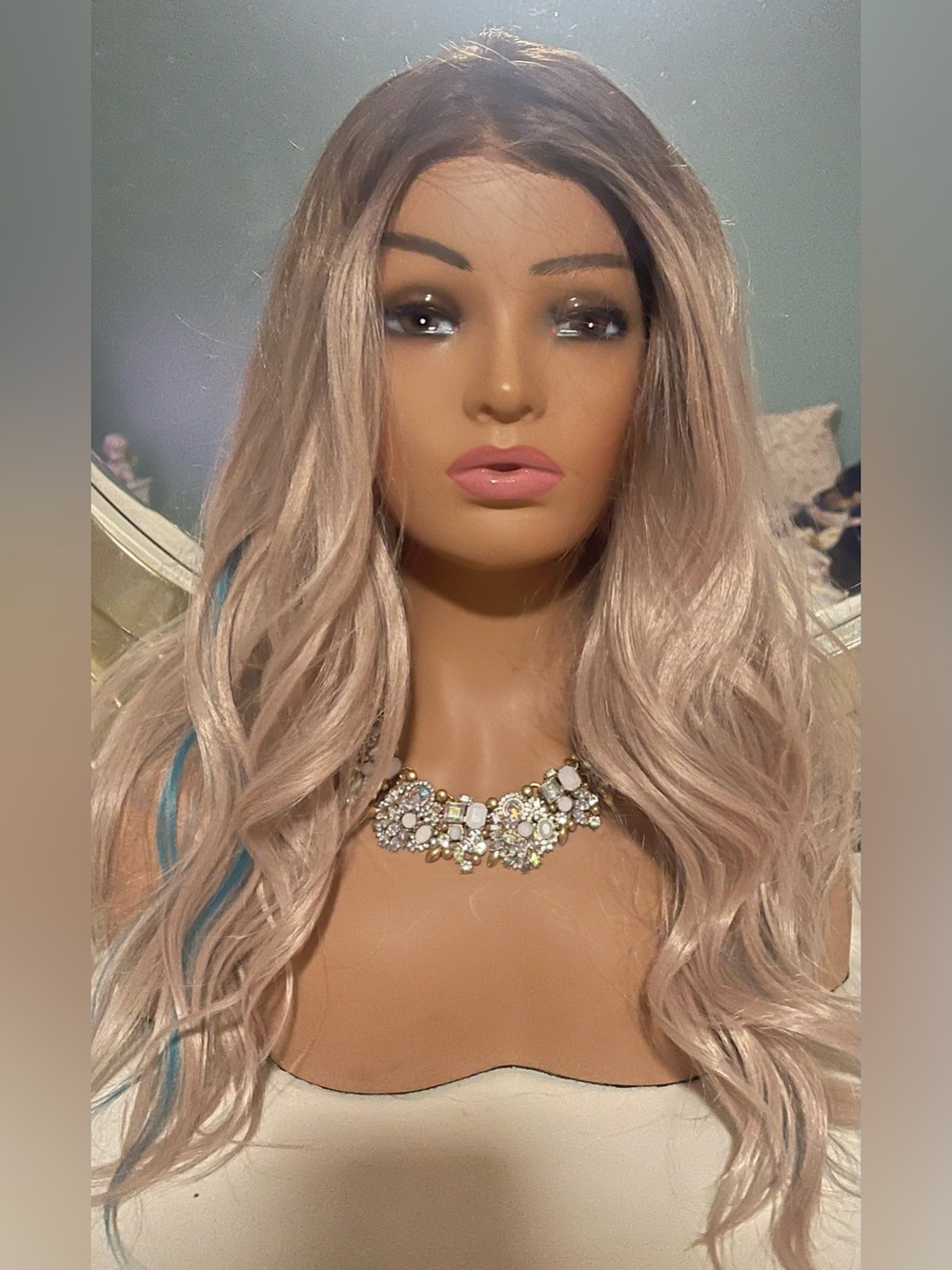 Chelsey Smith Crowns pinkish blonde with blue highlights